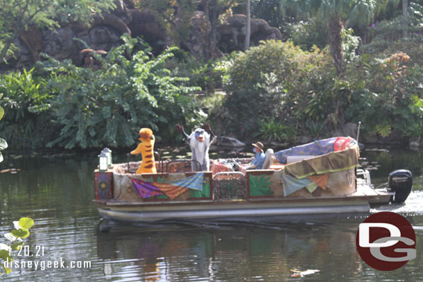 Animal Kingdom features Flotillas with characters and a band.  The boats circle Discovery Island throughout the day.  Here is Rafiki and Timon cruising by.