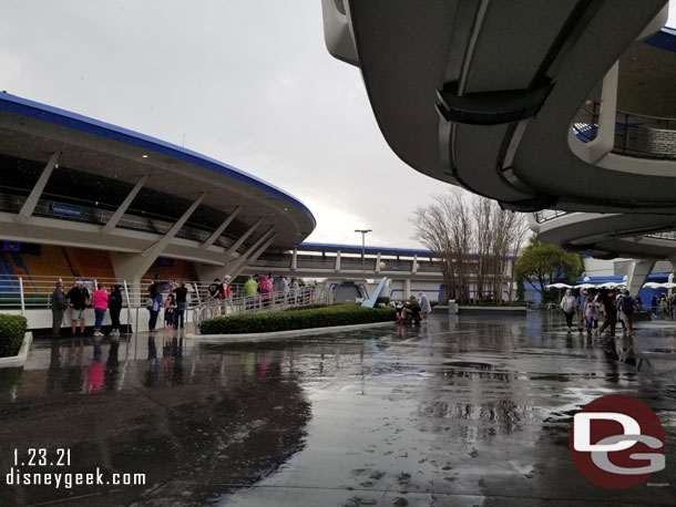 Because of distancing the queue for Carousel of Progress was out in the rain.