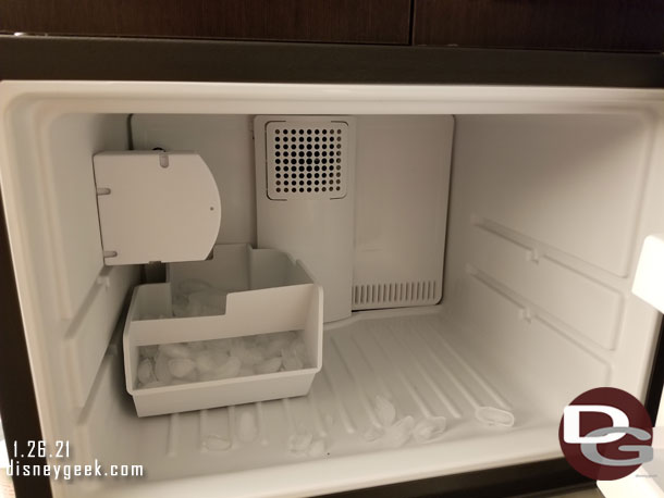 The freezer has an ice maker in it.