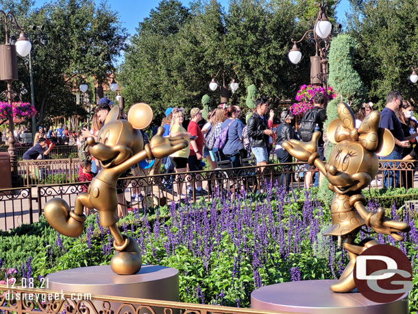 Mickey Mouse and Minnie Mouse Fab 50 statues in the hub.