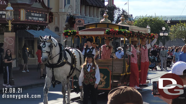 The Dapper Dans performing on a horse-drawn trolley this morning.