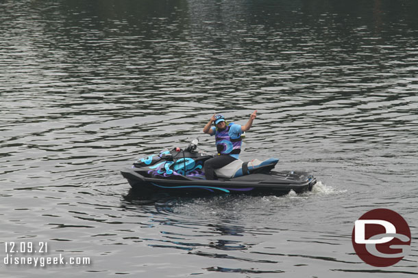 A cast member out on the water interacting with the crowd during a safety spiel.