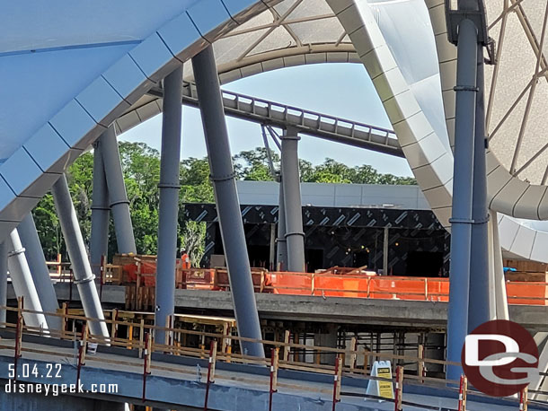 The opposite side of that structure along the walkway.  Best guess is it is for lockers or a gift shop. It looks rather open.