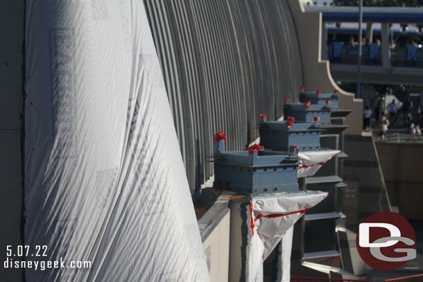 Work at the Tomorrowland Power Company gift shop.  Looks like the elements along the side are being removed.  This will make the walkway slightly wider.