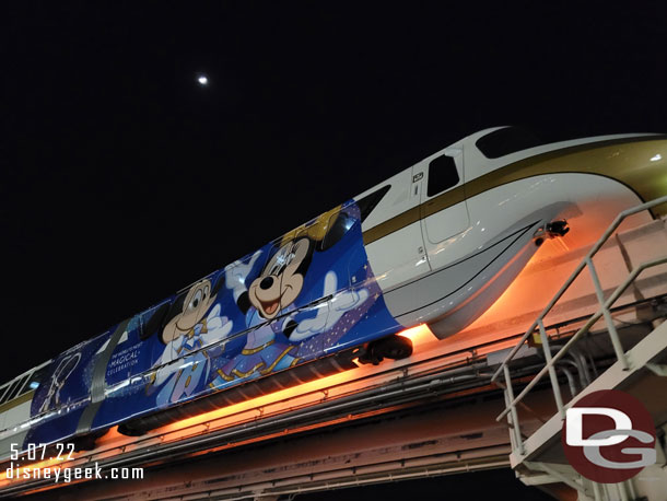 9:50pm - Walking to the Magic Kingdom to catch a bus.  Monorail Gold passing overhead.