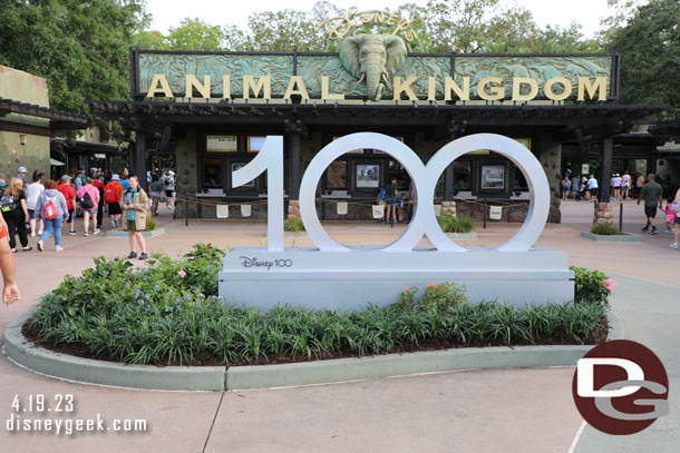 Disney 100 photo op in front of the park.