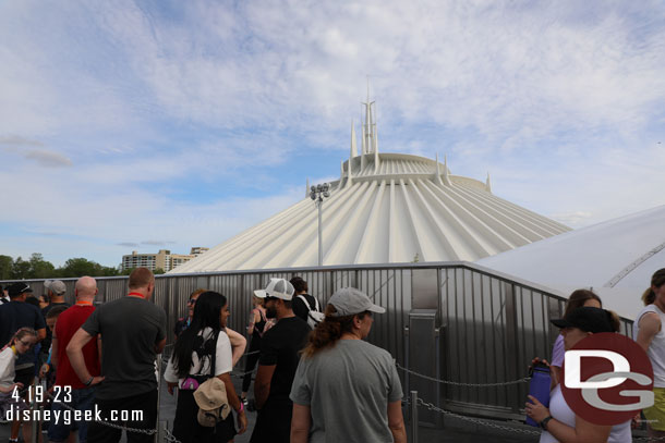 To obscure the backstage area between TRON and Space Mountain a metal mesh fence stretches the queue.