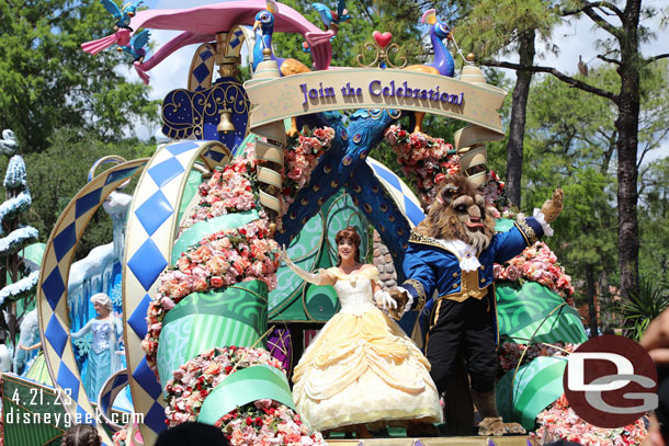 Time for the noon Festival of Fantasy Parade, Belle and the Beast on the lead float.