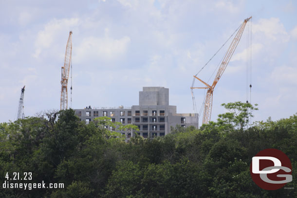 The Polynesian Village DVC tower over the tree line