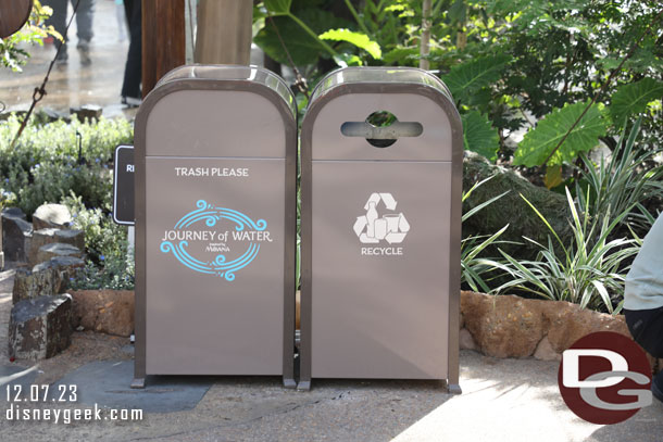 Trash cans in the area feature Journey of Water logos