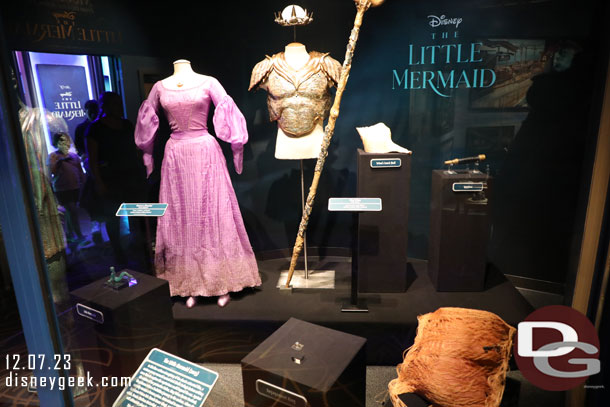 Some props and costumes from the Live Action The Little Mermaid on display near the meet and greet location.