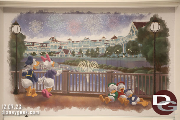 The artwork features Donald, Daisy and his nephews at the Beach Club Villas.