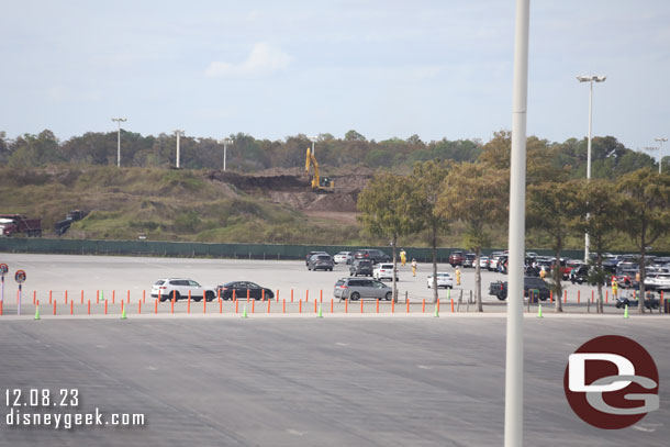 Crews were removing some dirt from the large mound in the Magic Kingdom parking lot today.  Assuming part of the ongoing roadwork projects