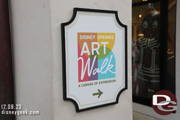 There is a Disney Springs Art Walk in the alley with the restrooms nearest the bus stops