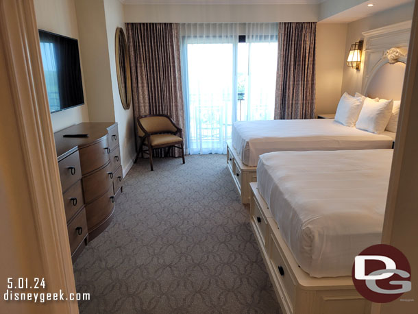 The bedroom had two beds, two chairs and a dresser.