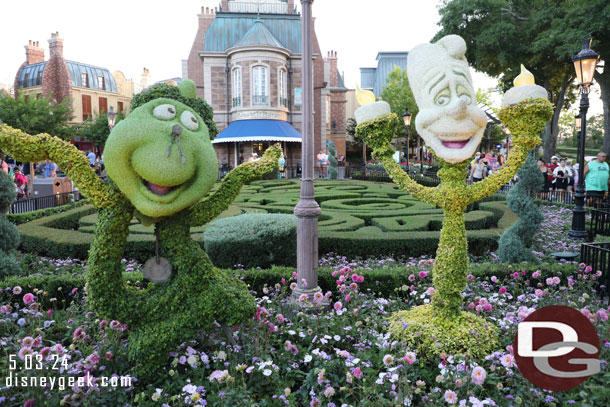 Cogsworth and Lumiere topiaries