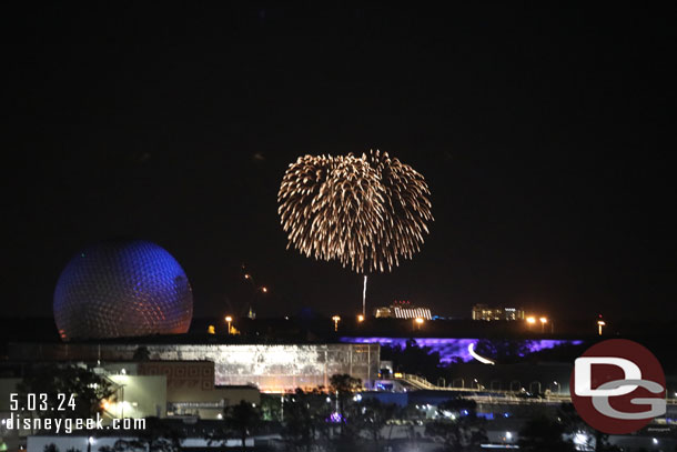 In the distance is Happily Ever After at the Magic Kingdom.