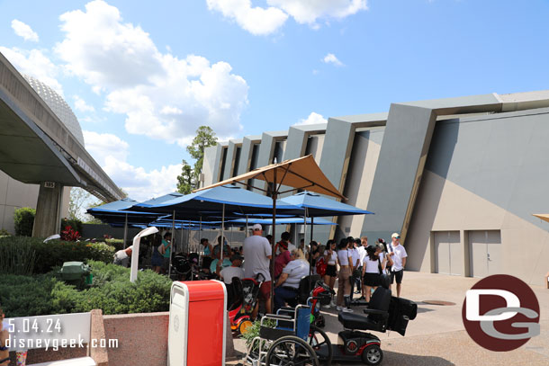 The shaded stroller parking has drawn a crowd looking for a spot out of the sun