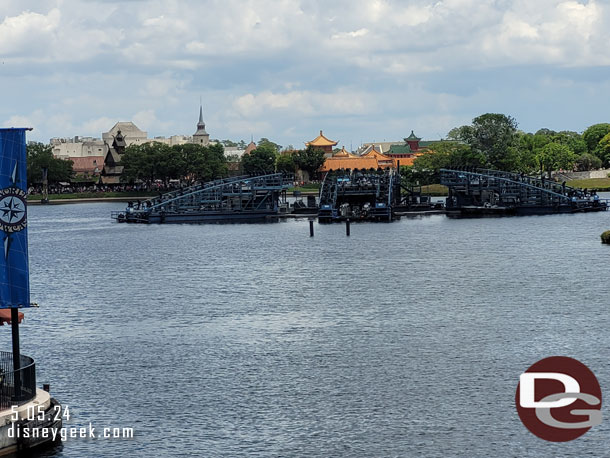 Luminous barges in World Showcase Lagoon, no activity at the moment out there.