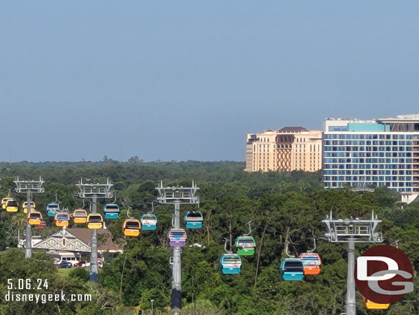 The Gran Destino Tower and Swan Reserve Towers to the right of the Disney Skyliner as it travels along Buena Vista Drive