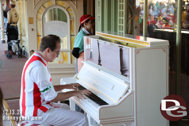 Piano Player on Main Street USA.  Challenging to stop and listen with the crowd and walkway.